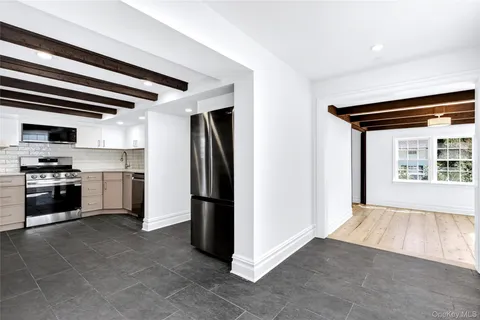 a kitchen with stainless steel appliances a refrigerator and a stove top oven