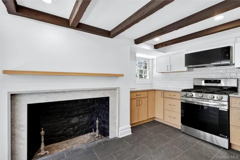 a kitchen with a stove and a microwave
