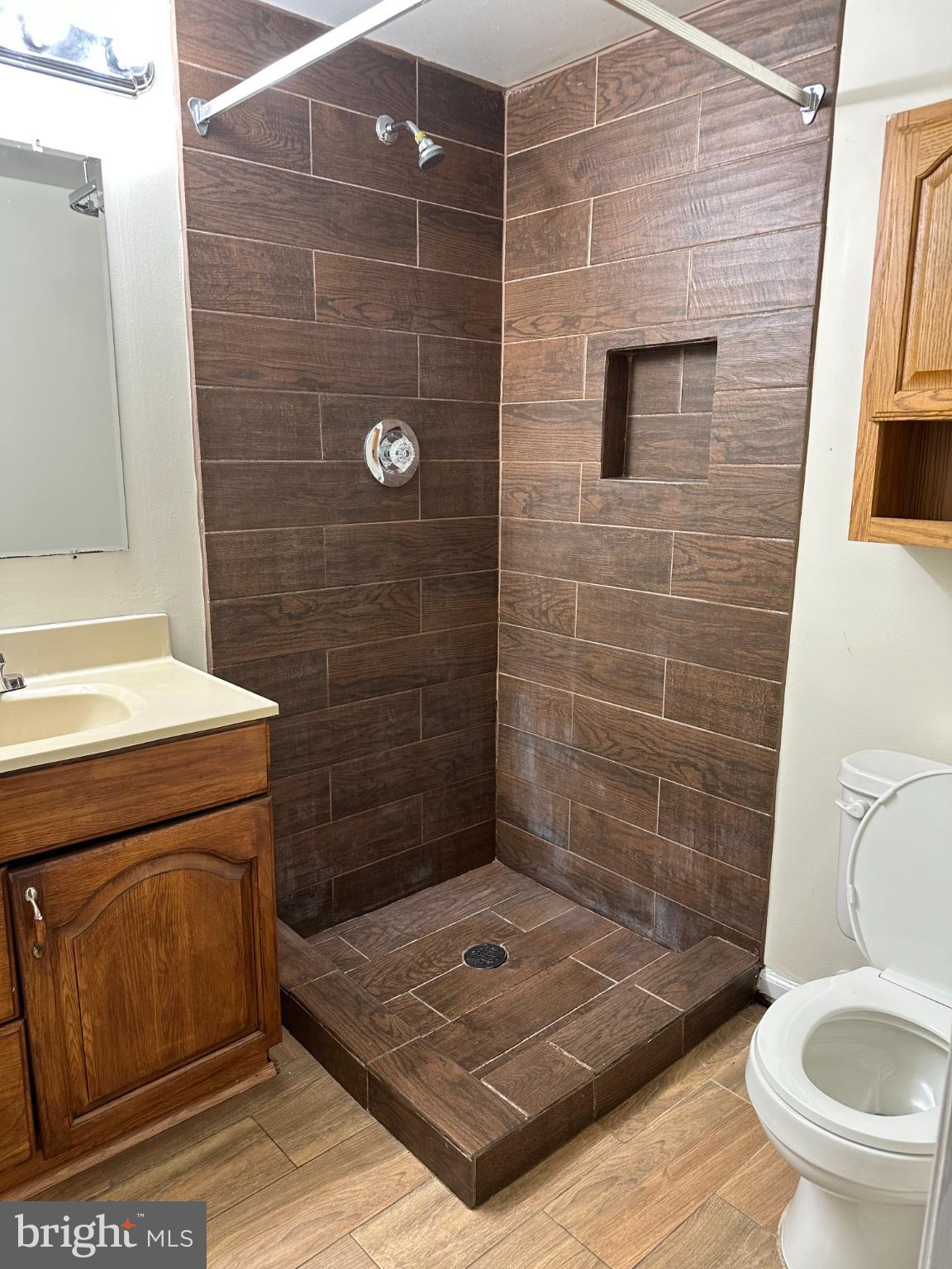 11130 Hollowbrook Road Owings Mills, MD 21117 - Photo 15 of 27 Modern shower with elegant tile design.