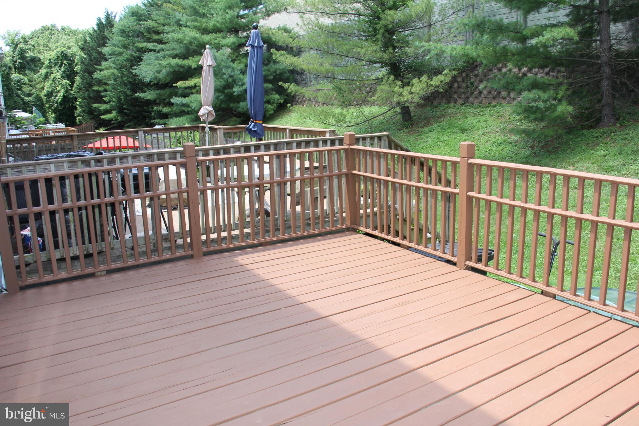 11130 Hollowbrook Road Owings Mills, MD 21117 - Photo 26 of 27 Spacious deck surrounded by lush greenery.