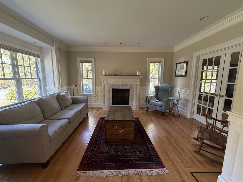 65 Denton Road Wellesley, MA 02482 - Photo 2 of 16 a living room with furniture fireplace and a window