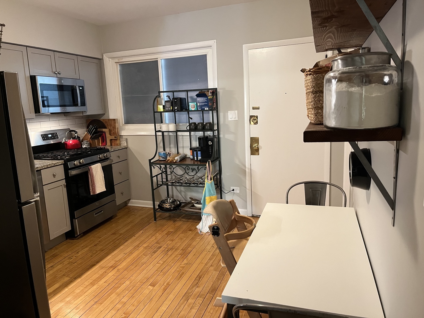 4128 North Lincoln Avenue, Unit 2R Chicago, IL 60618 - Photo 13 of 16 a living room with furniture and a flat screen tv