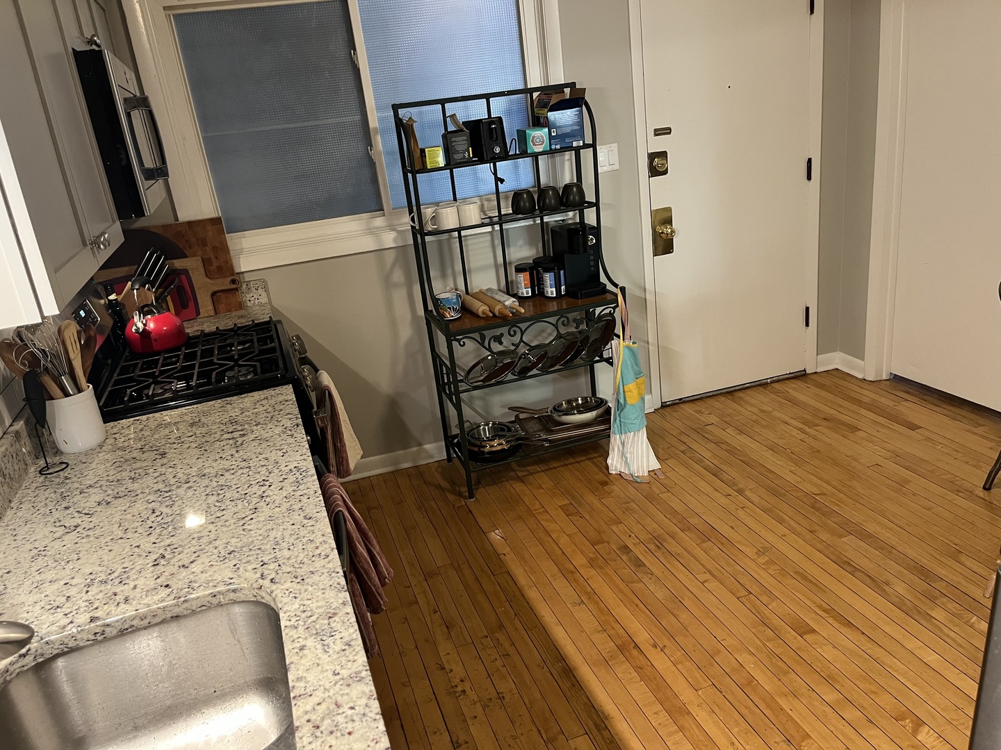 4128 North Lincoln Avenue, Unit 2R Chicago, IL 60618 - Photo 15 of 16 a view of a room with wooden floor and shoes