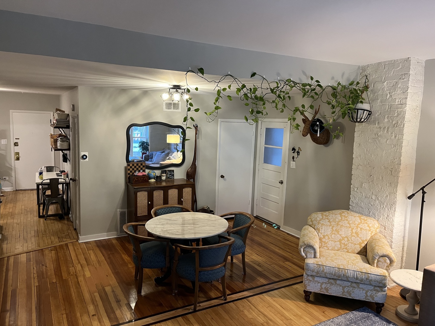 4128 North Lincoln Avenue, Unit 2R Chicago, IL 60618 - Photo 4 of 16 a living room with furniture and a chandelier