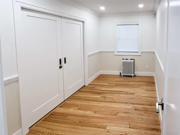 a bedroom with a bed and a table