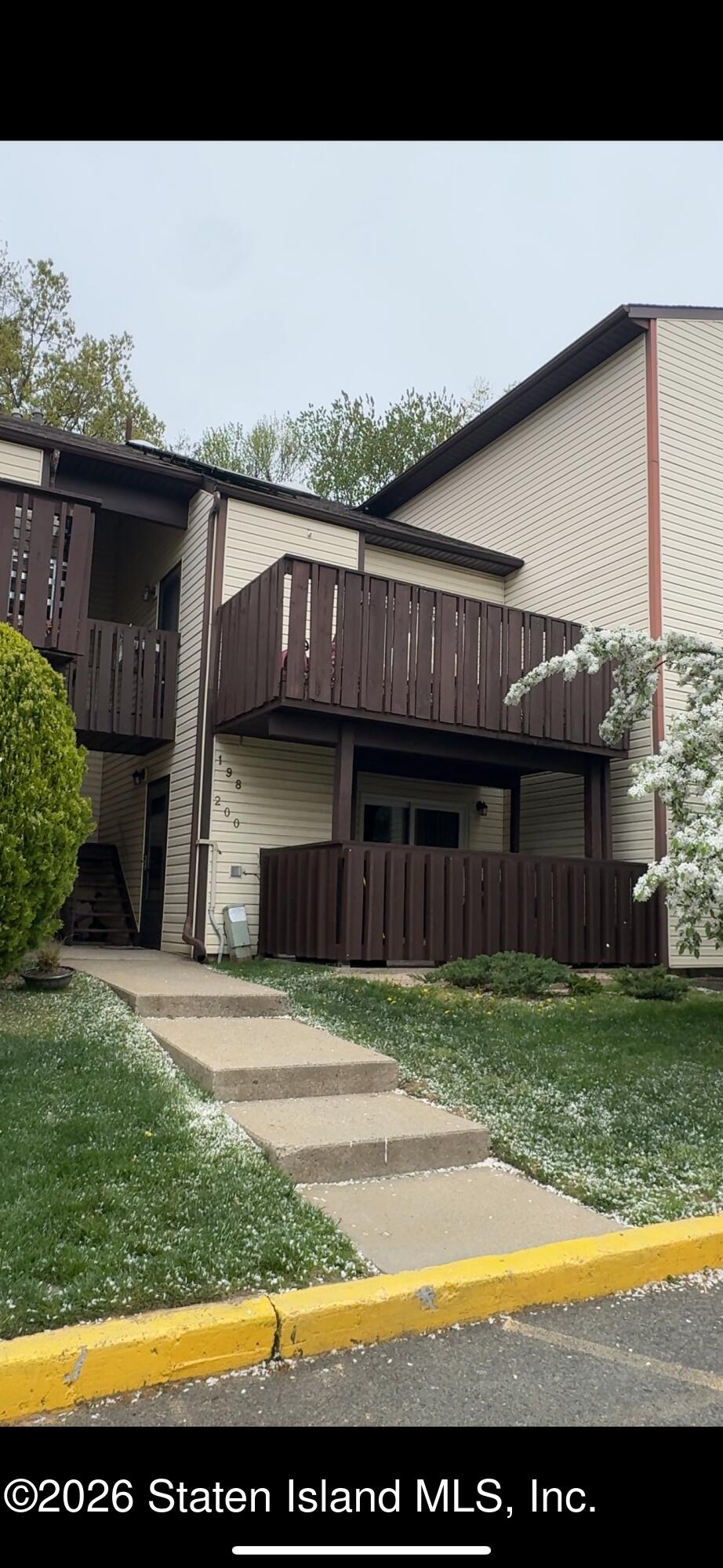 200 Timber Ridge Drive Staten Island, NY 10306 - Photo 1 of 1 a view of a house with a swimming pool