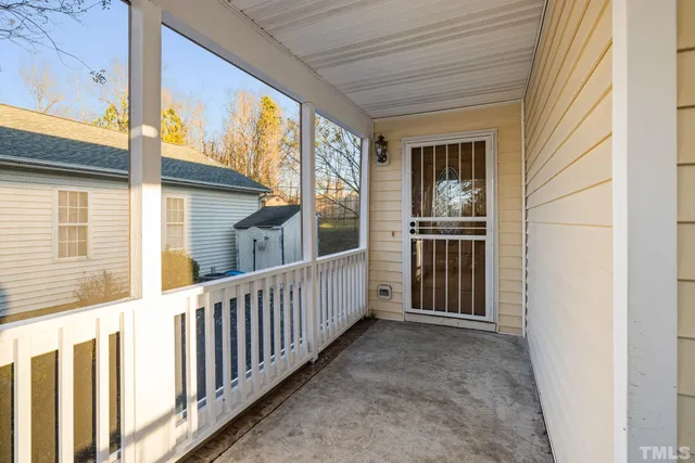 a view of a porch with wooden floor and stairs