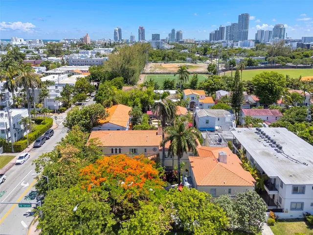 an aerial view of a house with yard swimming pool and outdoor seating