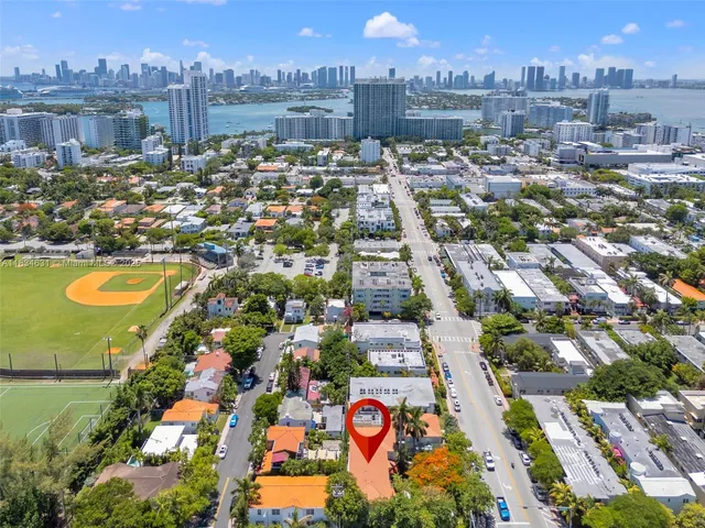 an aerial view of residential building and lake