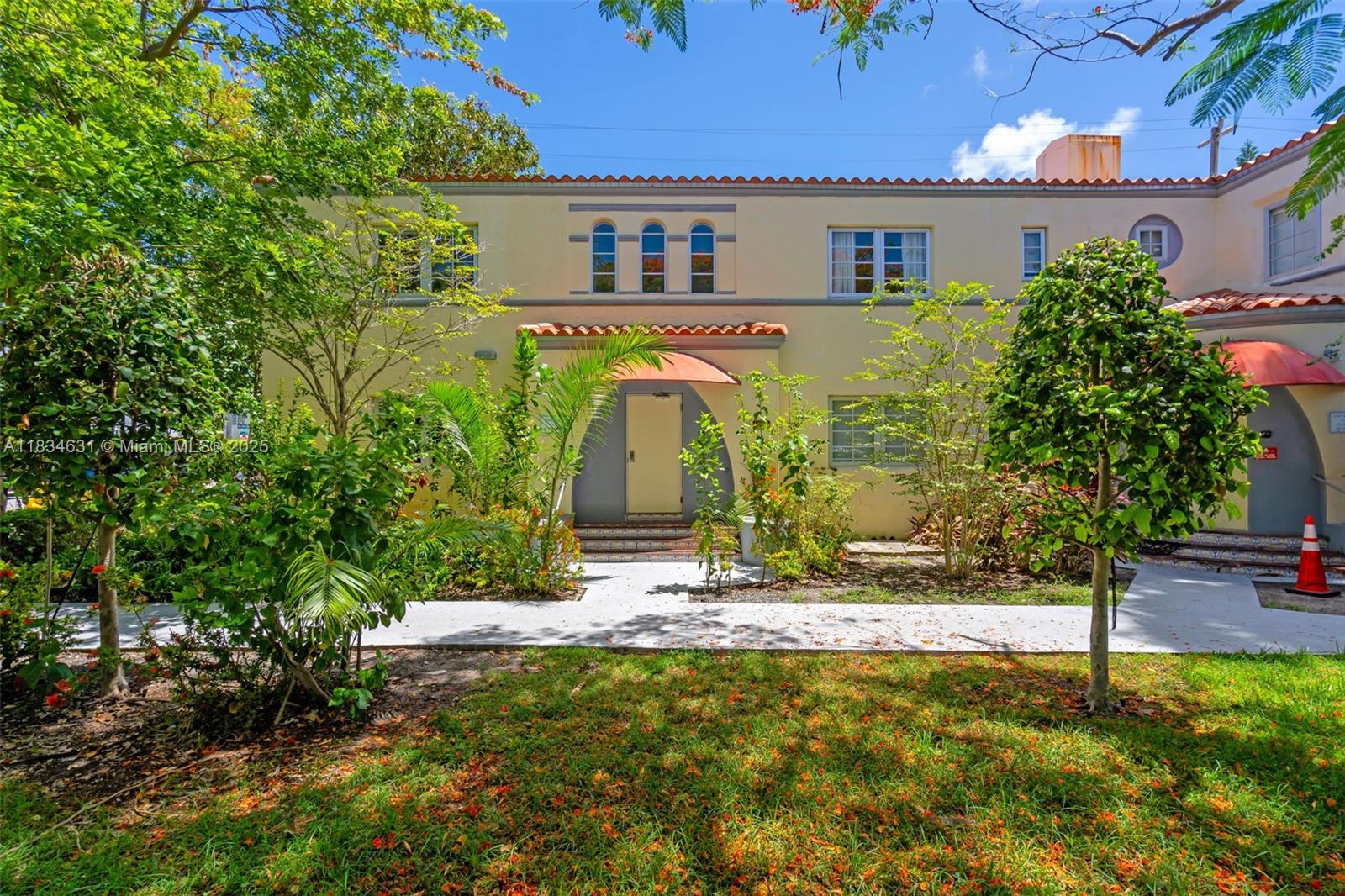 1450 Meridian Avenue, Unit 202 Miami Beach, FL 33139 - Photo 3 of 29 a front view of a house with garden