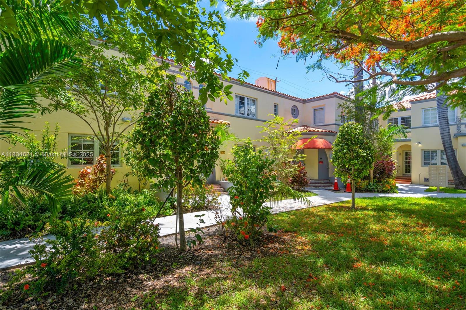 1450 Meridian Avenue, Unit 202 Miami Beach, FL 33139 - Photo 4 of 29 a view of a house with a yard and tree s
