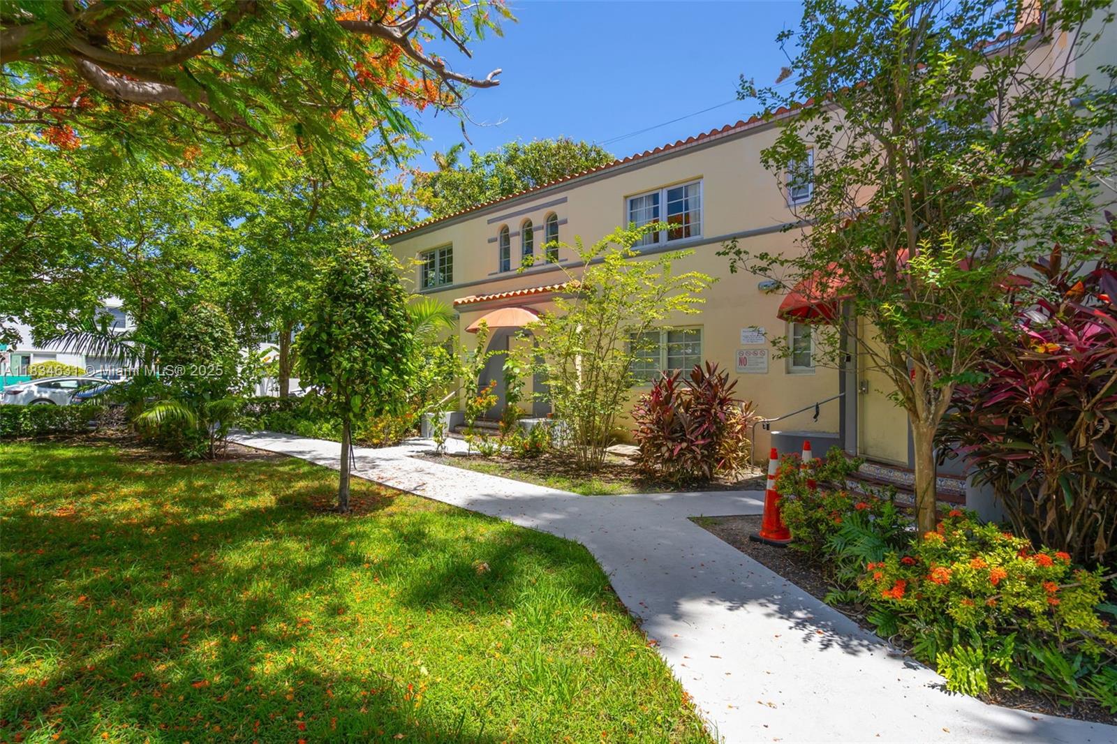 1450 Meridian Avenue, Unit 202 Miami Beach, FL 33139 - Photo 5 of 29 a backyard of a house with a garden and plants