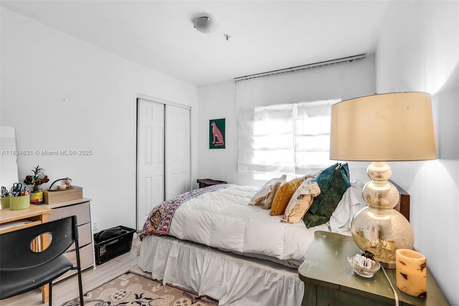 1450 Meridian Avenue, Unit 202 Miami Beach, FL 33139 - Photo 10 of 29 a bedroom with a bed and a window