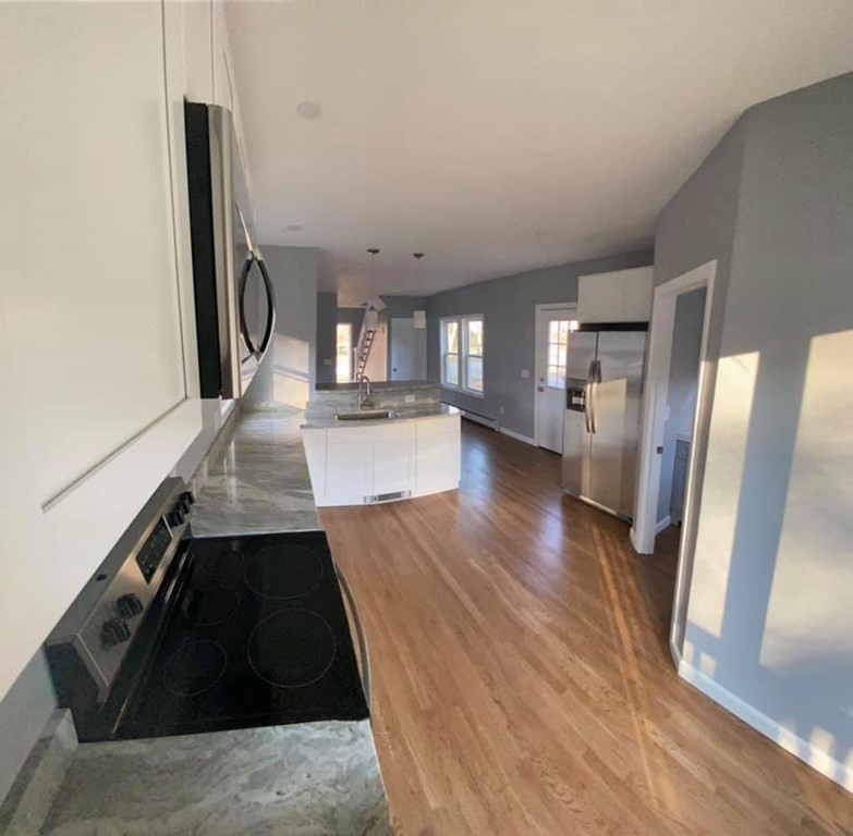 66 Ruggles Street Hardwick, MA 01031 - Photo 3 of 37 a view of a kitchen from the hallway
