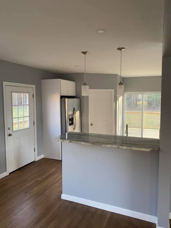 66 Ruggles Street Hardwick, MA 01031 - Photo 8 of 37 an empty room with wooden floor and window