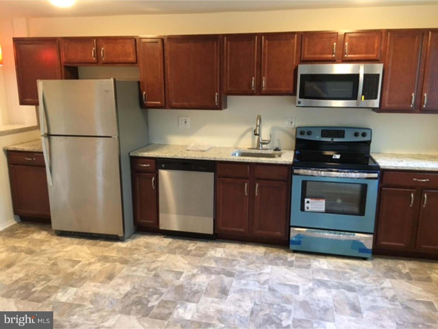 1341 Rainer Road Brookhaven, PA 19015 - Photo 1 of 23 a kitchen with a sink and a stove