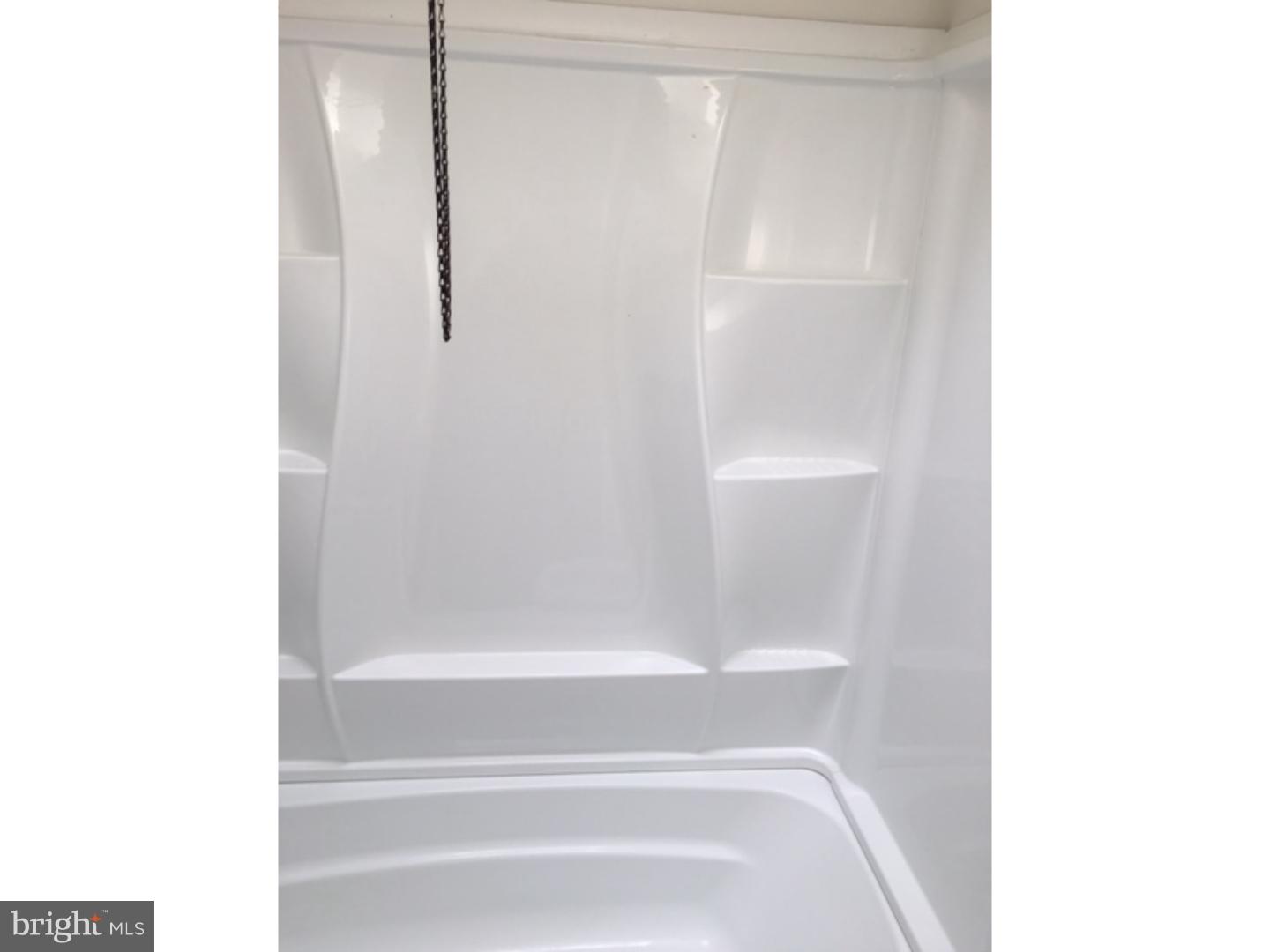 1341 Rainer Road Brookhaven, PA 19015 - Photo 13 of 23 a bathroom with a glass shower door