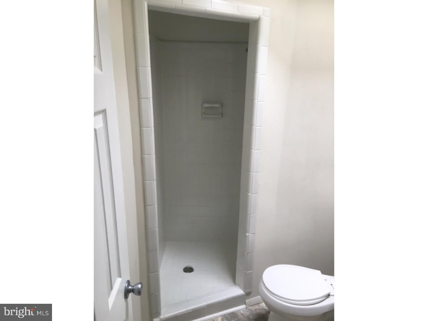 1341 Rainer Road Brookhaven, PA 19015 - Photo 15 of 23 a white toilet sitting next to a bathroom sink