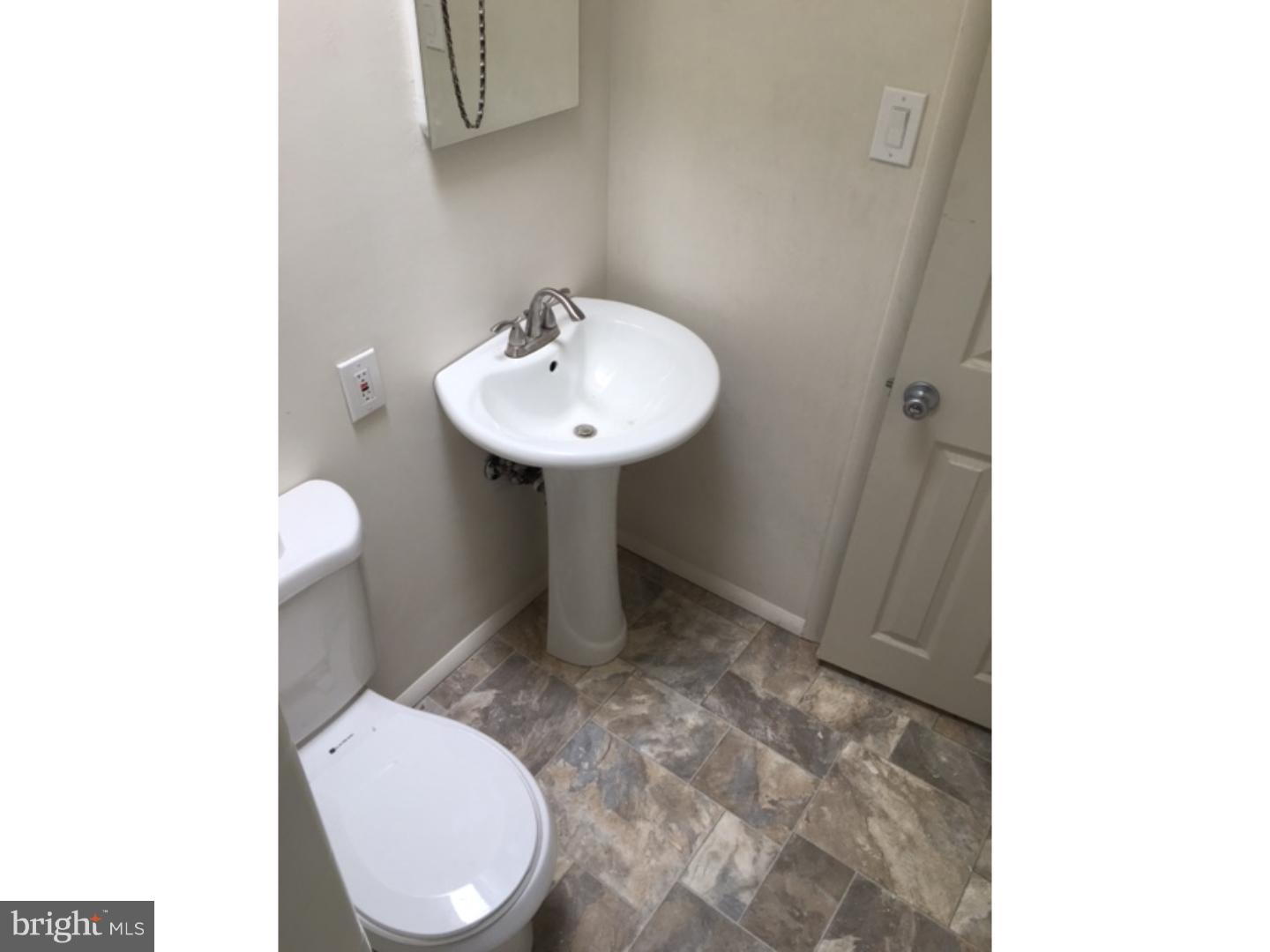 1341 Rainer Road Brookhaven, PA 19015 - Photo 16 of 23 a bathroom with a sink toilet and a mirror