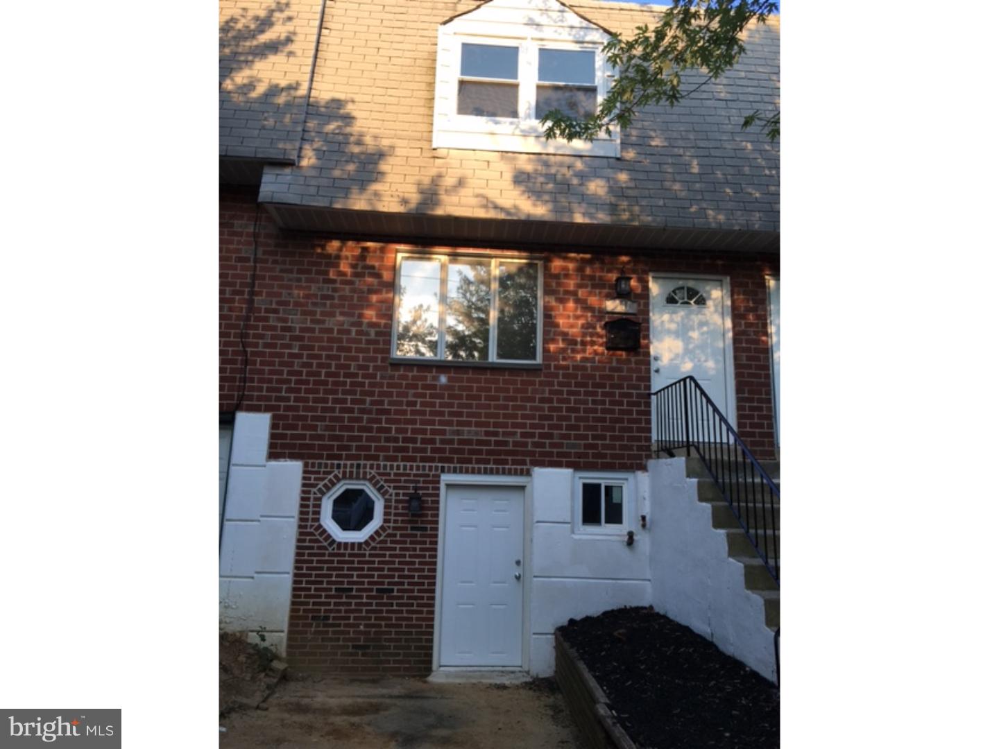 1341 Rainer Road Brookhaven, PA 19015 - Photo 18 of 23 a view of a brick house with large windows