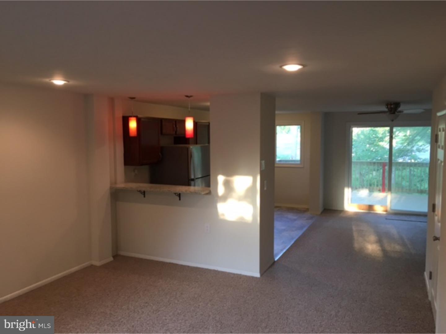1341 Rainer Road Brookhaven, PA 19015 - Photo 20 of 23 a view of empty room with wooden floor and windows