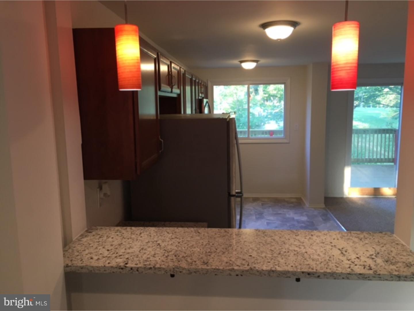1341 Rainer Road Brookhaven, PA 19015 - Photo 3 of 23 a bedroom with a bed and wooden floor