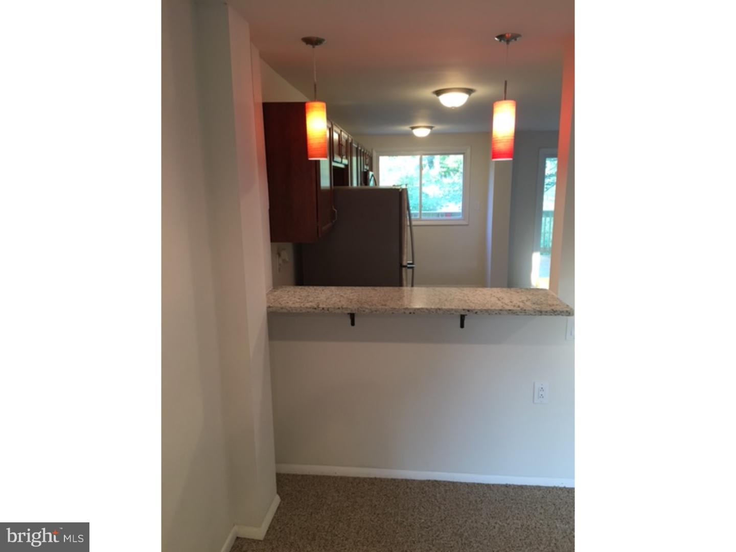 1341 Rainer Road Brookhaven, PA 19015 - Photo 21 of 23 a view of a bathroom with a sink and mirror