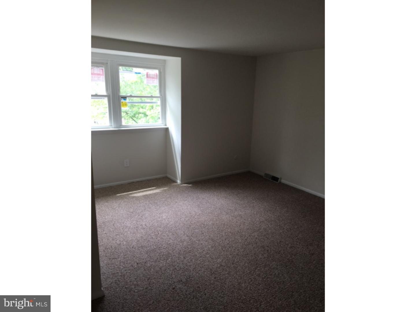 1341 Rainer Road Brookhaven, PA 19015 - Photo 7 of 23 a view of an empty room with a window