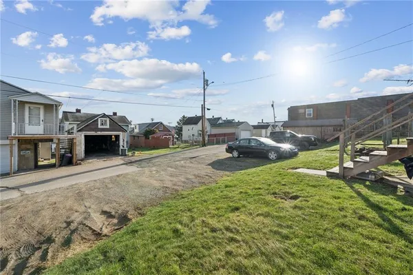 a view of a house with a backyard