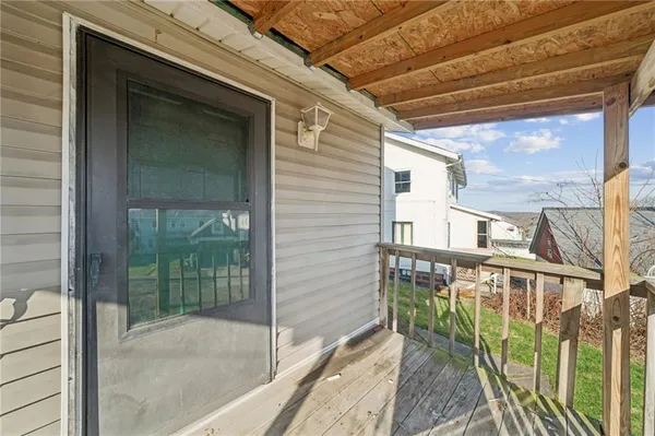 a view of balcony with wooden floor