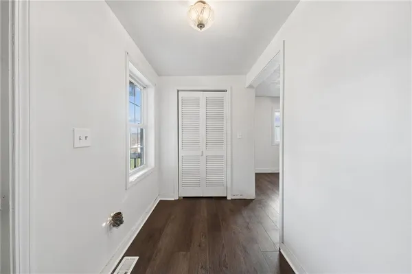 a view of entryway with wooden floor