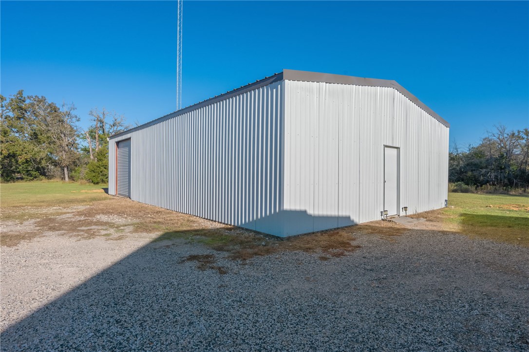 11688 Long Trussel Road Bryan, TX 77808 - Photo 24 of 29 a view of backyard with large trees