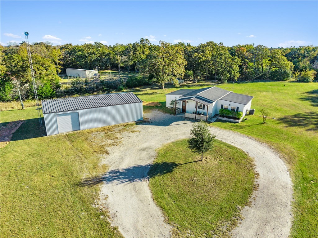 11688 Long Trussel Road Bryan, TX 77808 - Photo 28 of 29 a view of a swimming pool with a patio