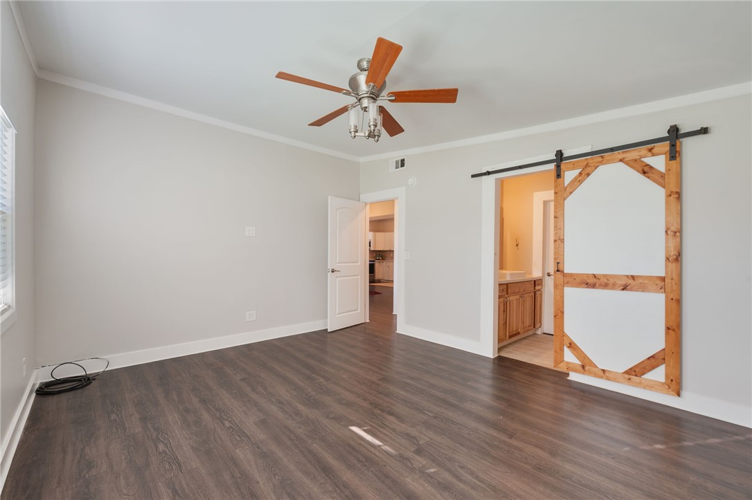 11688 Long Trussel Road Bryan, TX 77808 - Photo 10 of 29 an empty room with wooden floor closet and windows