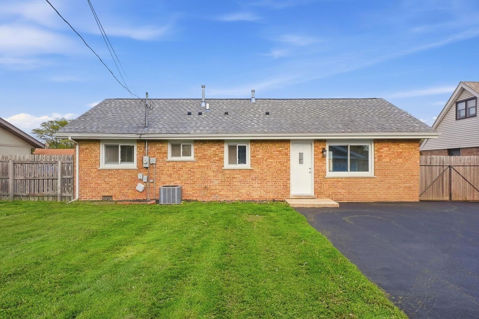 8718 Cranbrook Lane Bridgeview, IL 60455 - Photo 15 of 24 a view of a house with a backyard