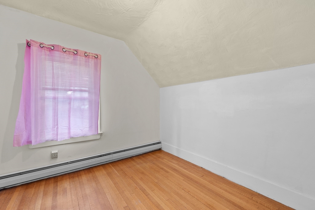 75 Plain Street Lowell, MA 01851 - Photo 12 of 17 a view of a small space with wooden floor and a window