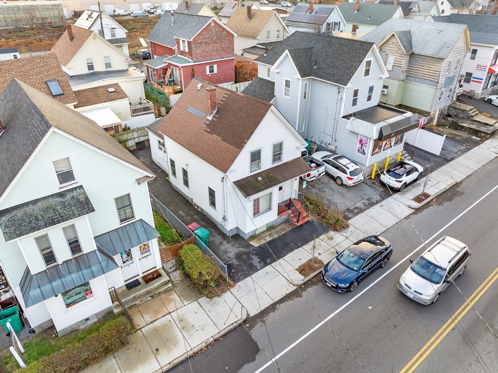75 Plain Street Lowell, MA 01851 - Photo 14 of 17 an aerial view of residential houses with outdoor space