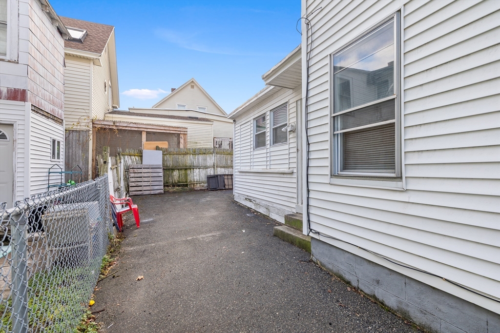 75 Plain Street Lowell, MA 01851 - Photo 15 of 17 a view of back yard of the house