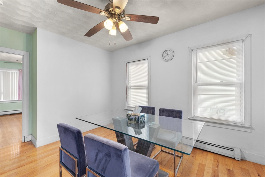 75 Plain Street Lowell, MA 01851 - Photo 6 of 17 a view of a dining room with furniture window and wooden floor
