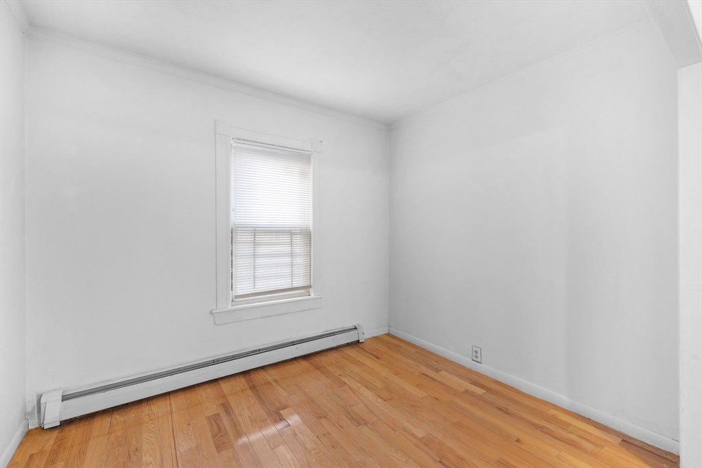 75 Plain Street Lowell, MA 01851 - Photo 7 of 17 an empty room with a window