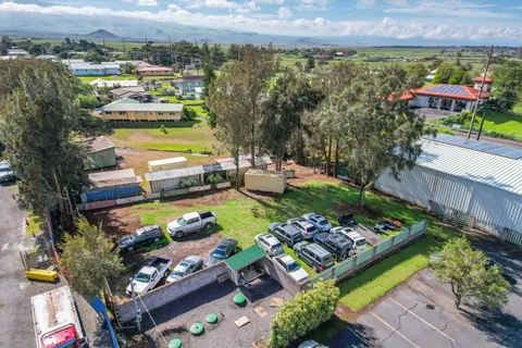 a view of yard with swimming pool and green space