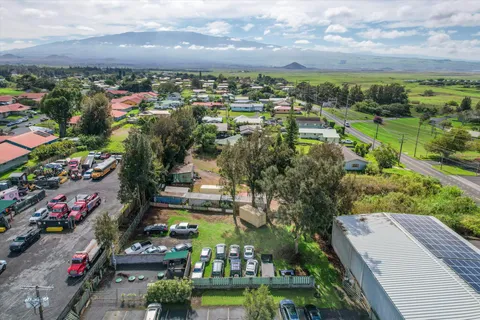 a view of a park with houses