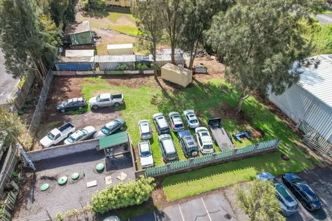 a view of yard with swimming pool and green space
