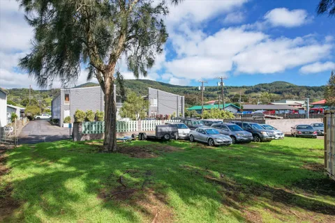 a view of street with parked cars