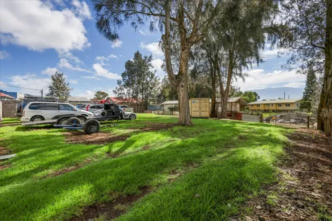 a view of a car parked in front of a house