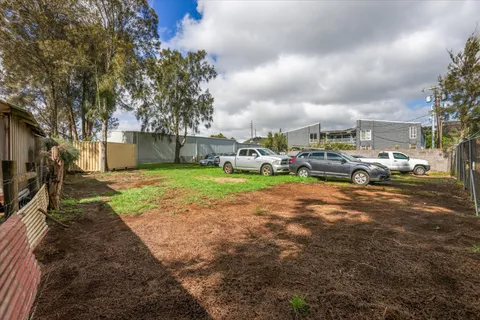 a view of a street with a building in the background