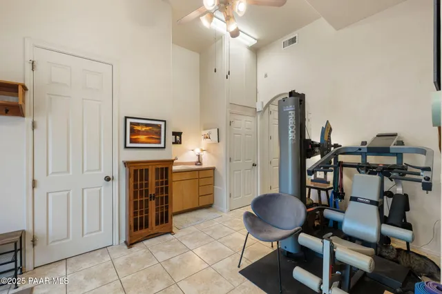 a view of patio with table and chairs and potted plants