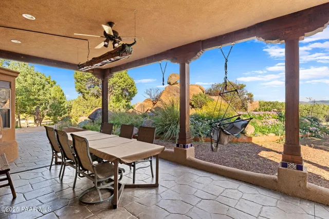 an aerial view of a house with garden space and street view