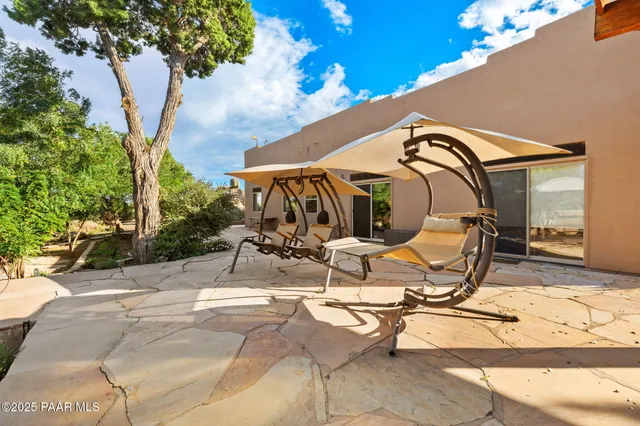 a view of a house with wooden fence