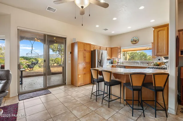 a kitchen with a stove a sink and a microwave